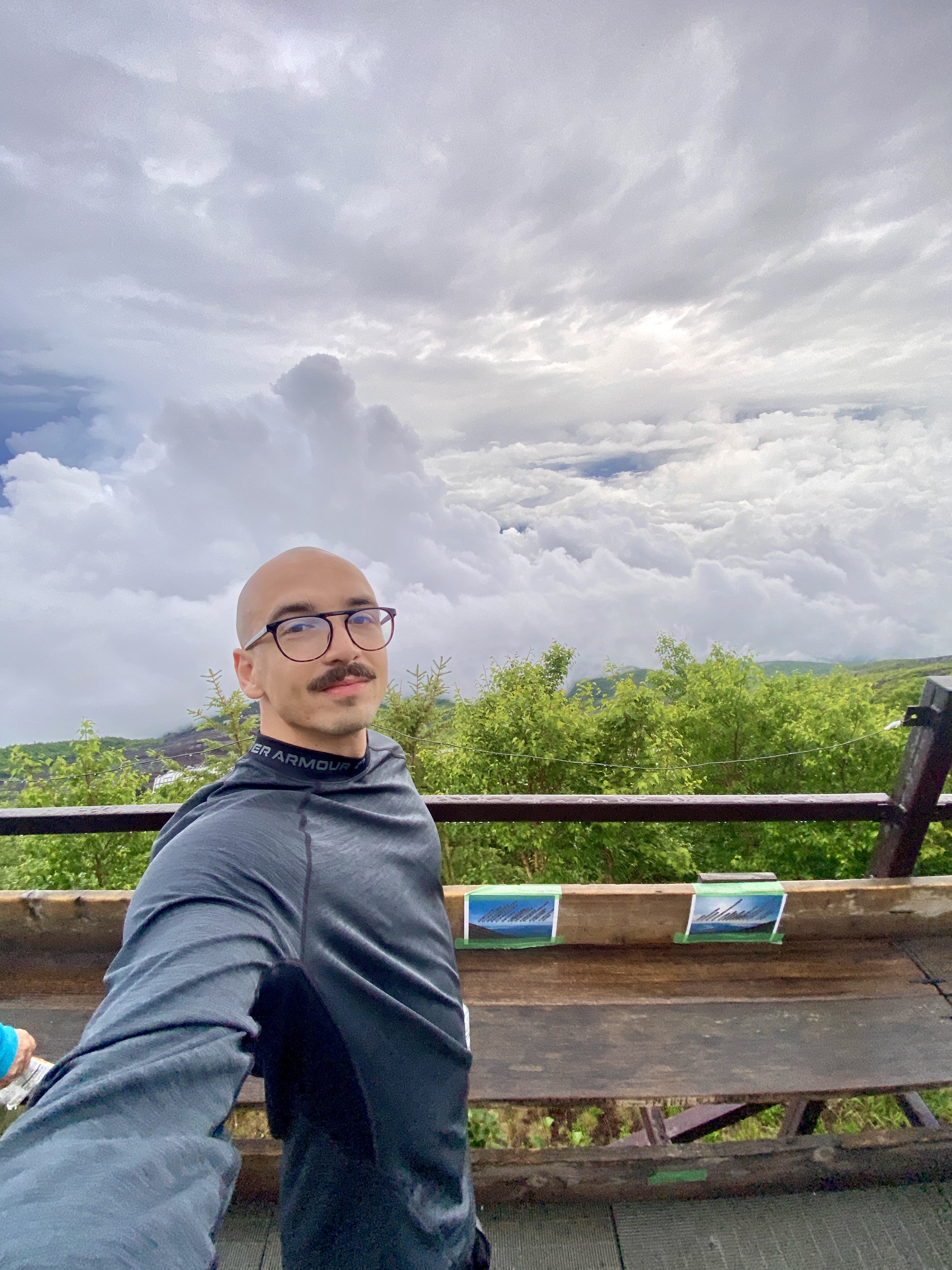 Maros Gorny hiking on Mt. Fuji in Japan above the clouds
